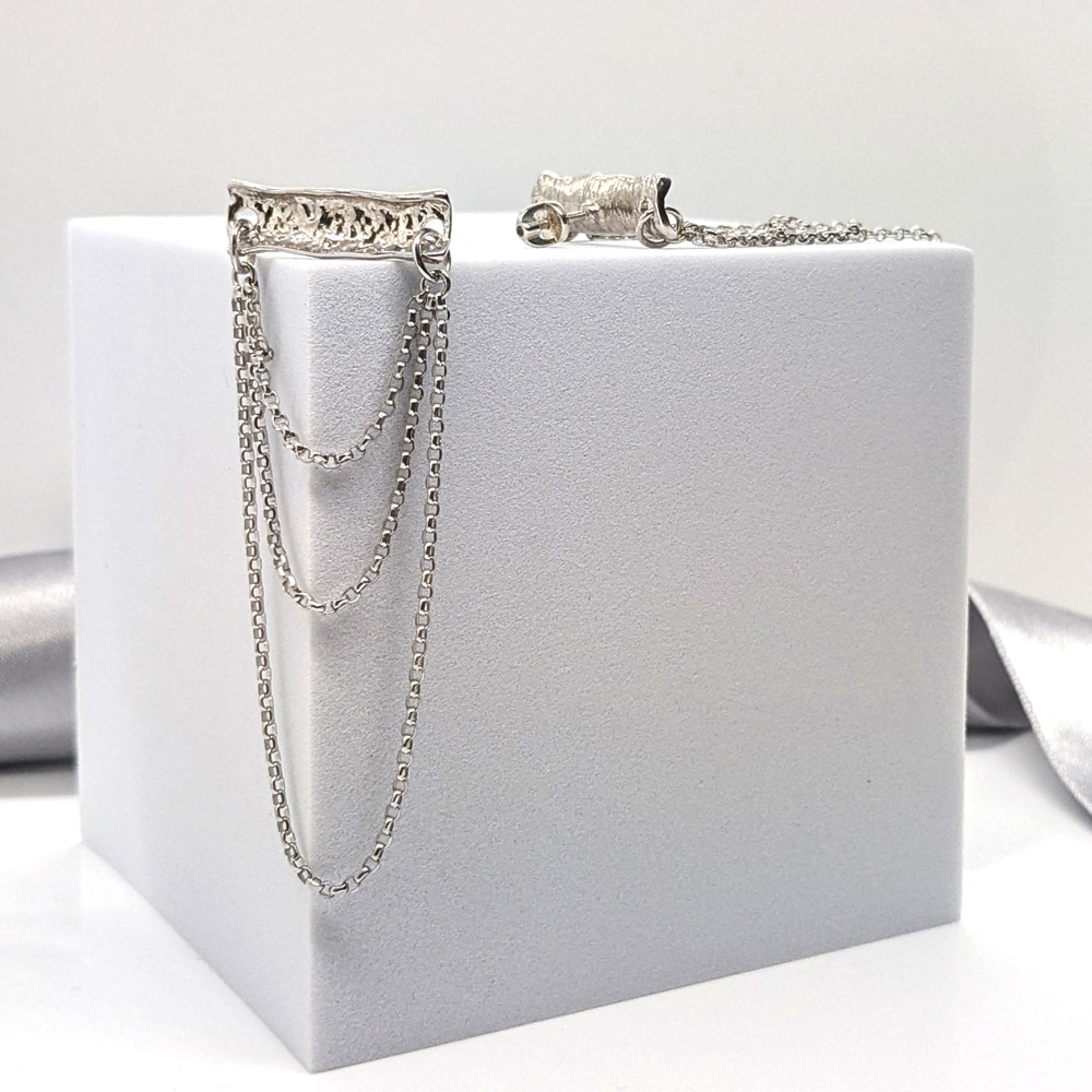 silver earrings with chains_