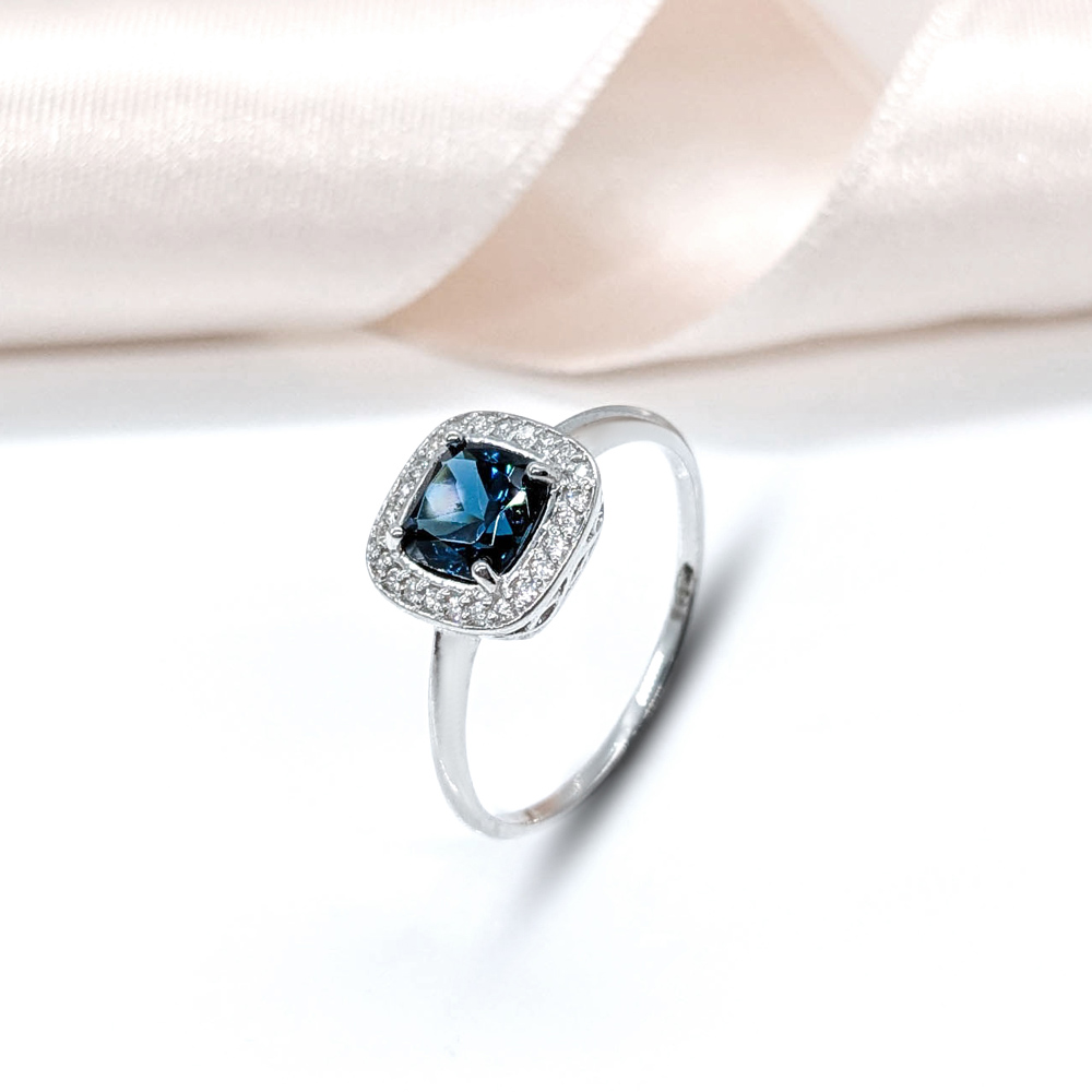 silver ring with blue cushion