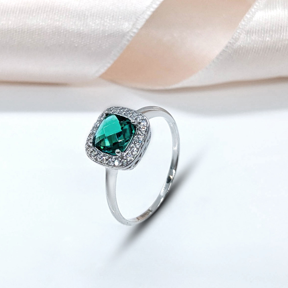 silver ring with dark green cushion